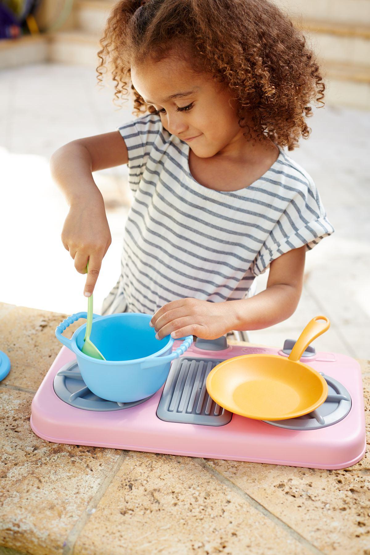 Girl playing with Chef Set