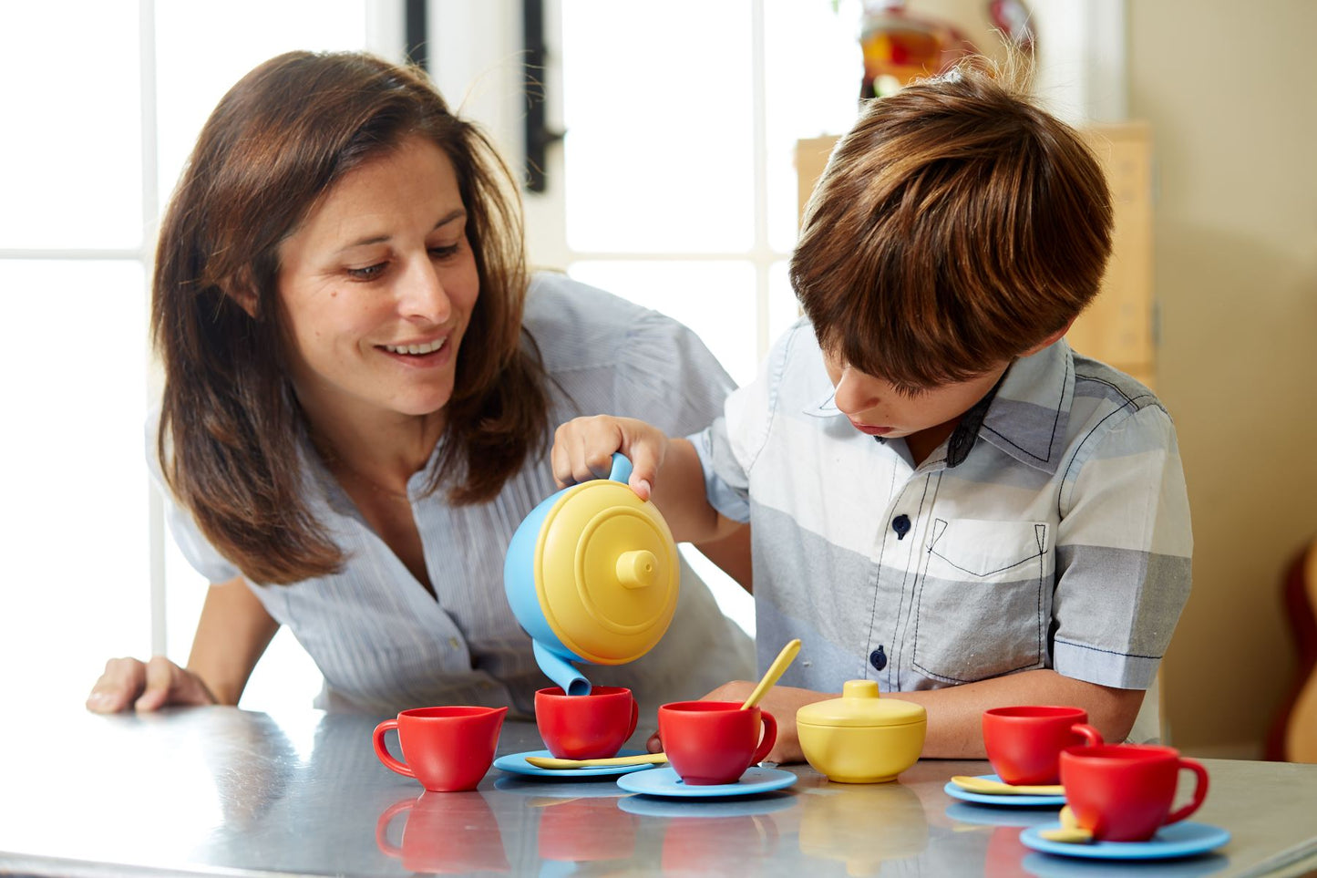 Adult and boy with Blue Tea Set