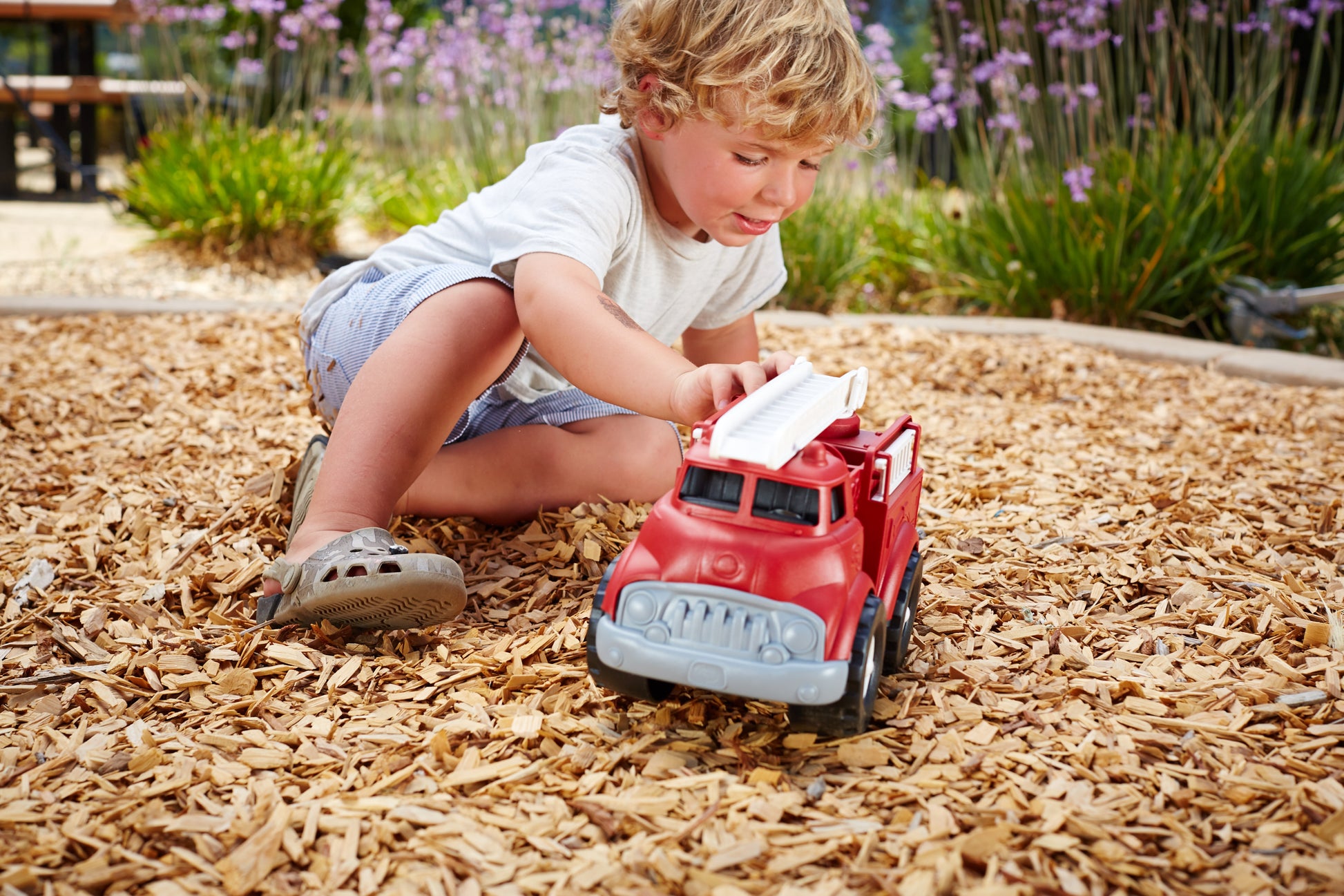 Boy playing with Fire Truck