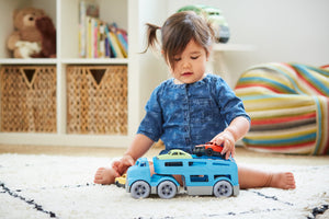 Girl playing with Car Carrier