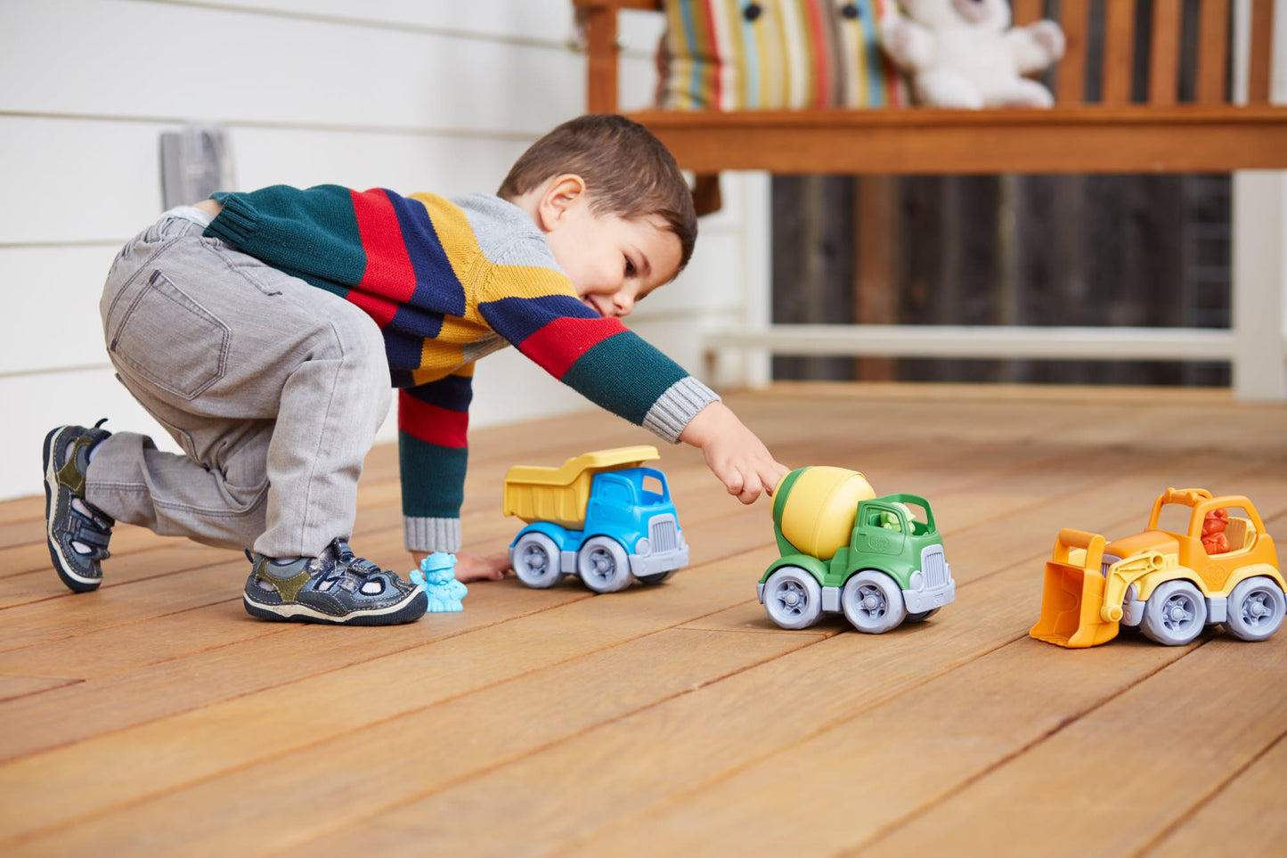 Boy playing with Construction Trucks