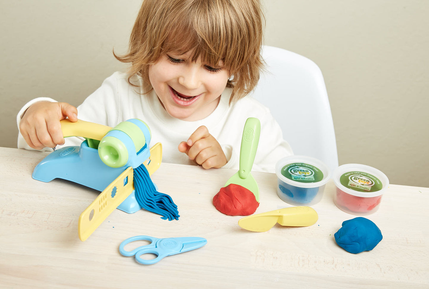 Boy playing with Extruder Dough Set
