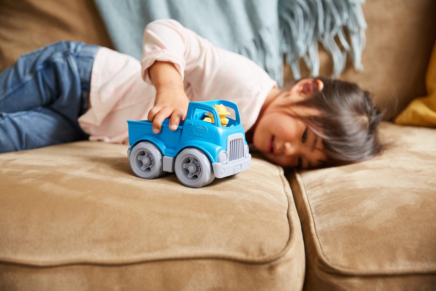 Girl playing with Pick-Up Truck