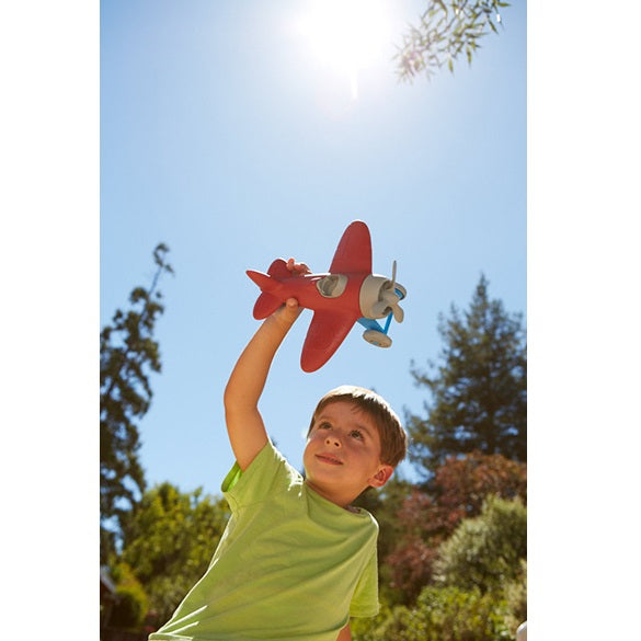 Boy playing with Airplane