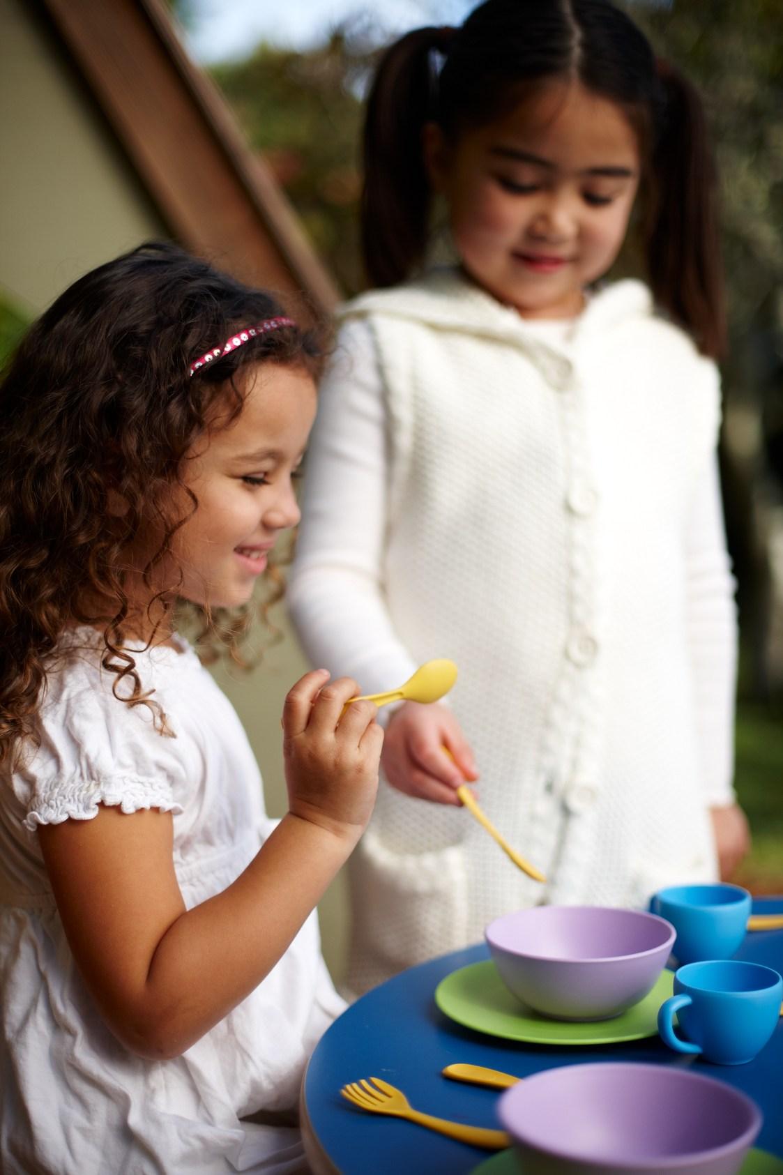 Girls playing with Dish Set