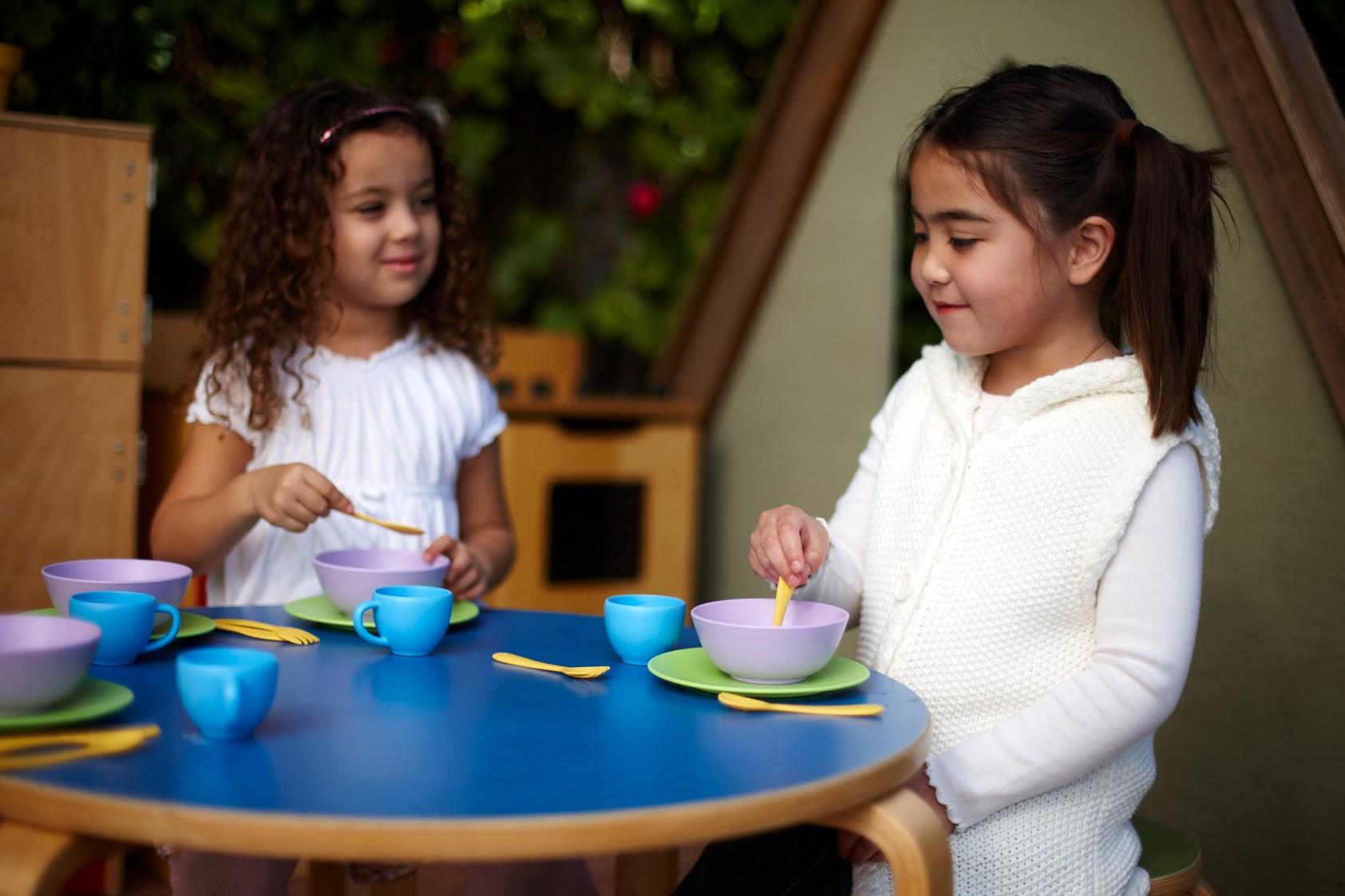 Girls playing with Dish Set