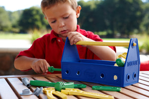 Boy playing with Blue Tool Set