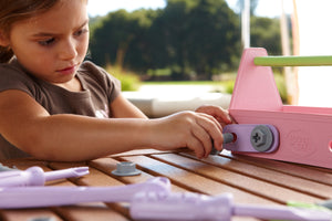 Girl playing with Pink Tool Set