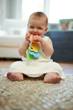 Load image into Gallery viewer, Baby girl chewing on First Keys