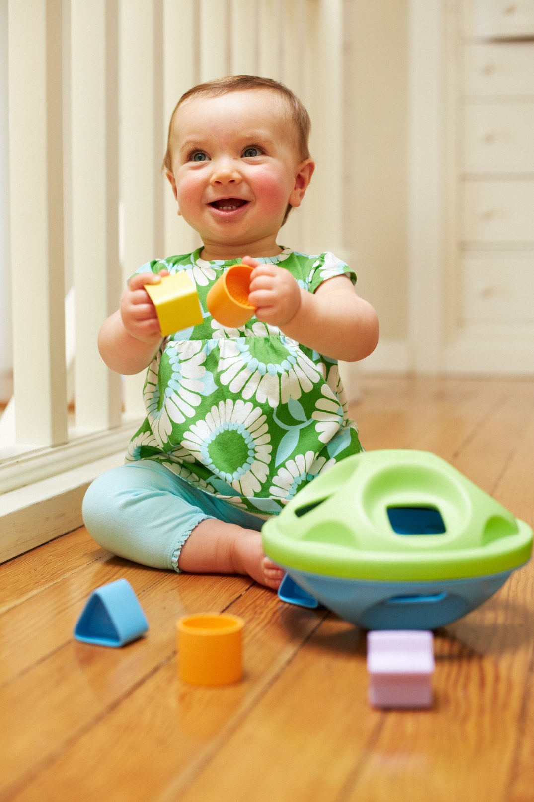 Girl playing with Shape Sorter