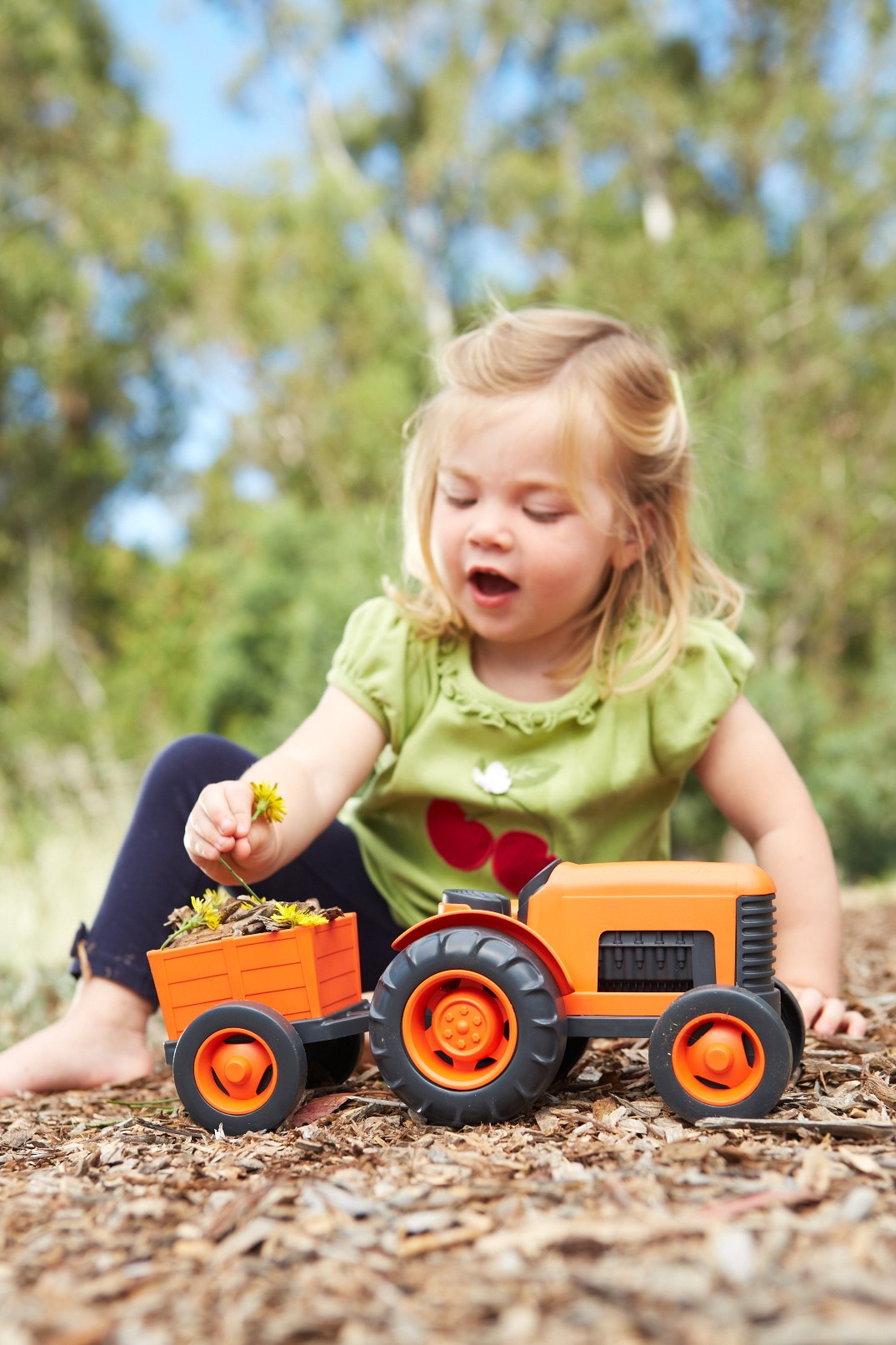 Girl playing with Tractor