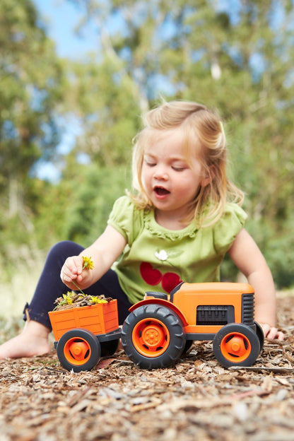 Girl playing with Tractor