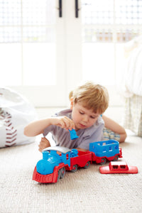Boy playing with Train and bears