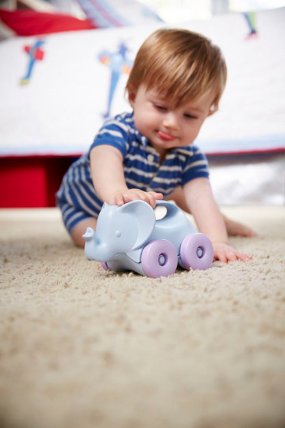 Baby playing with Elephant-on-wheels from the Baby Toy Starter Set