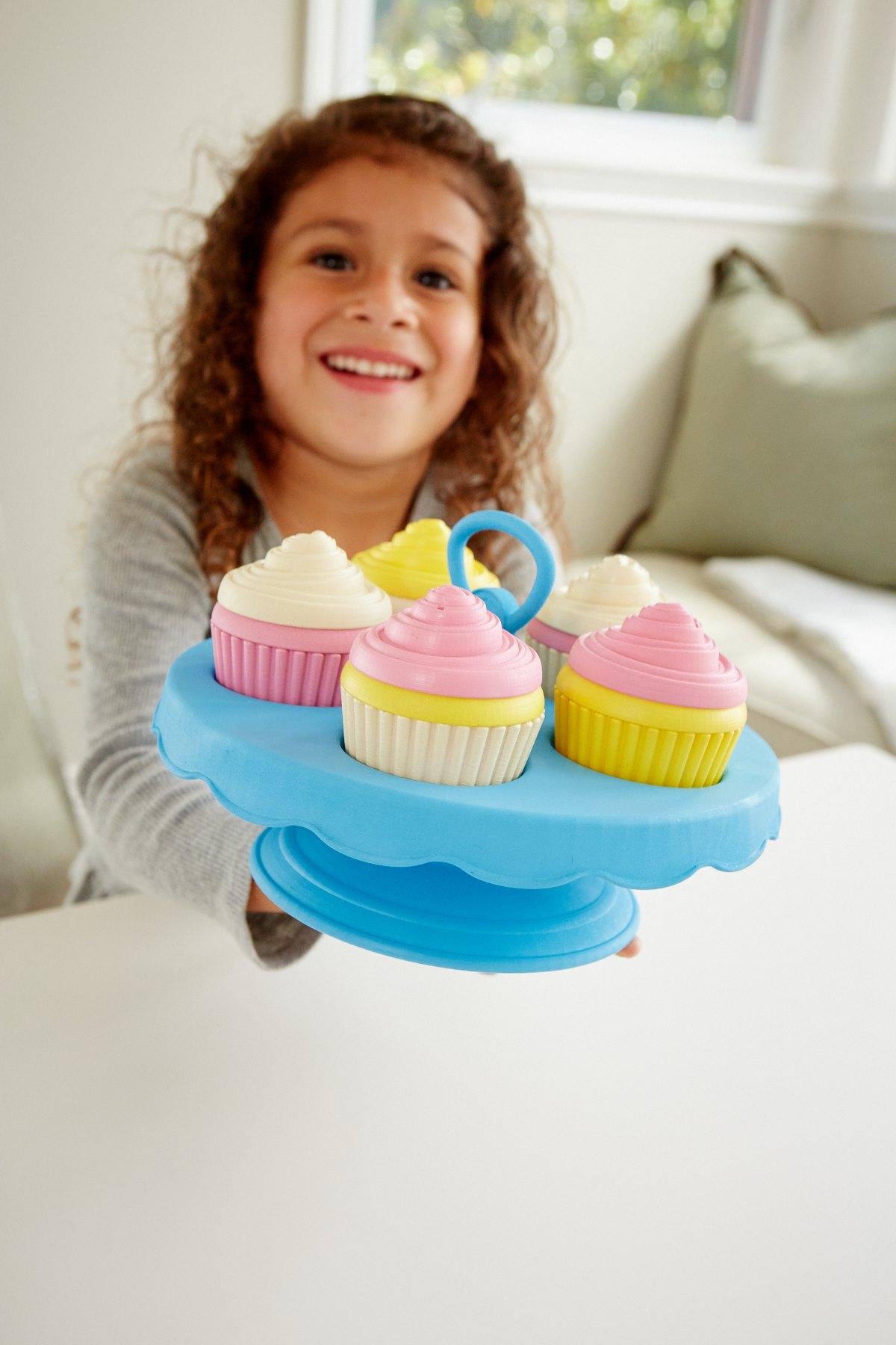 Girl playing with Cupcake Set