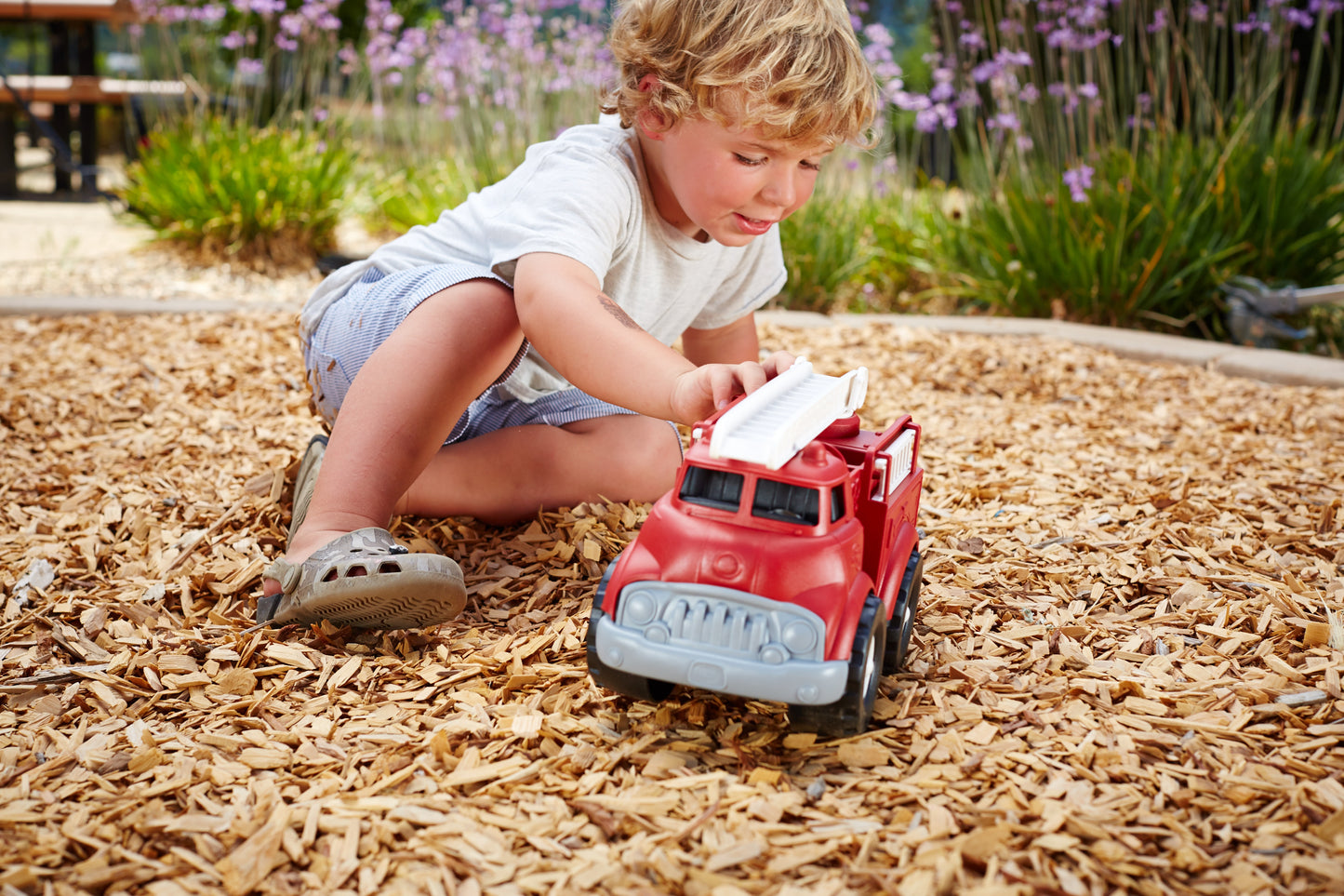 Boy playing with Fire Truck