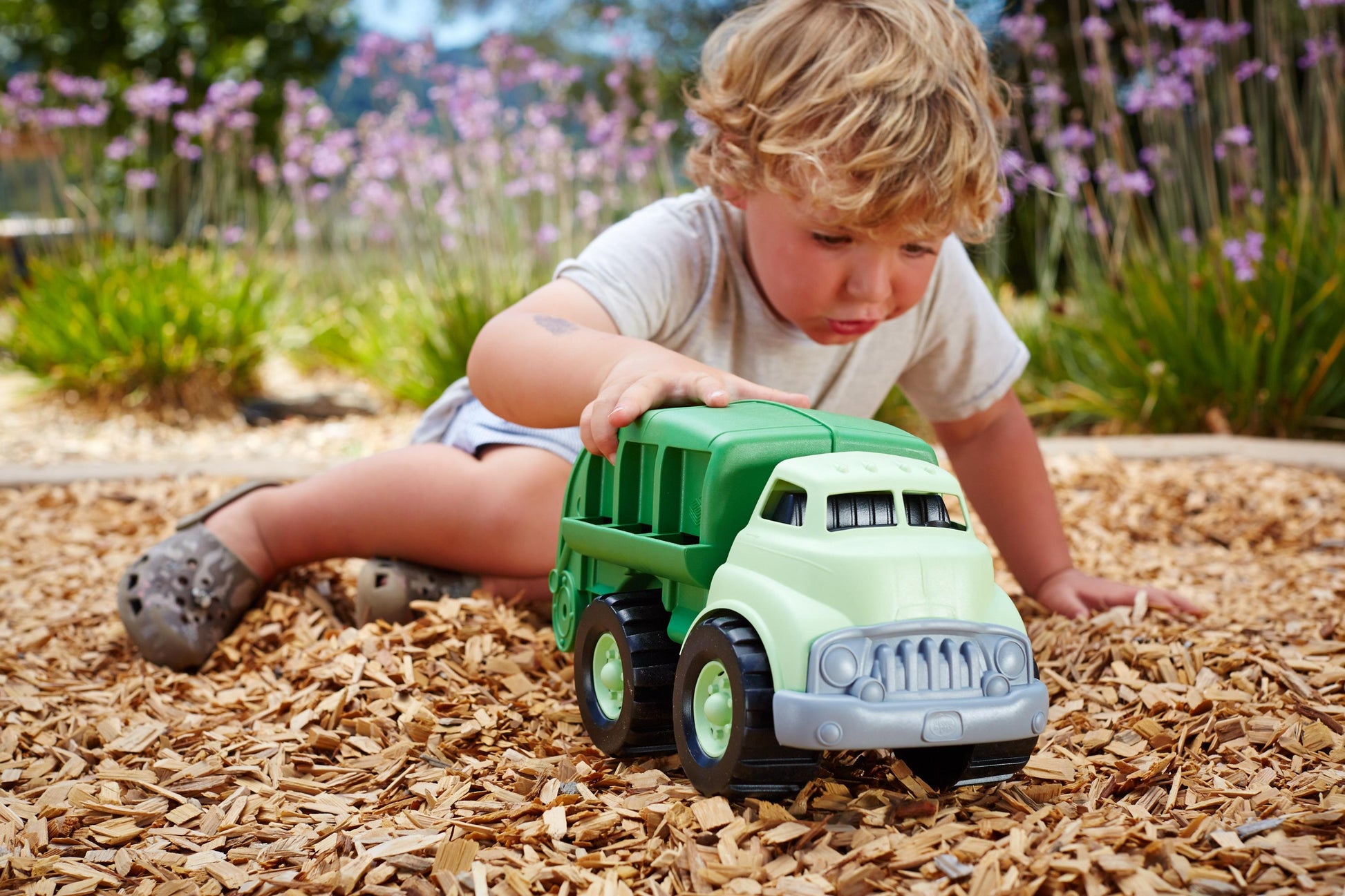 Boy playing with Recycling Truck