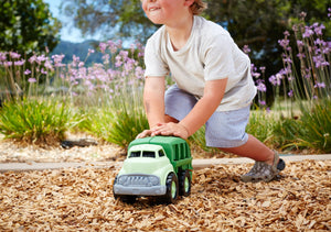 Boy playing with Recycling Truck