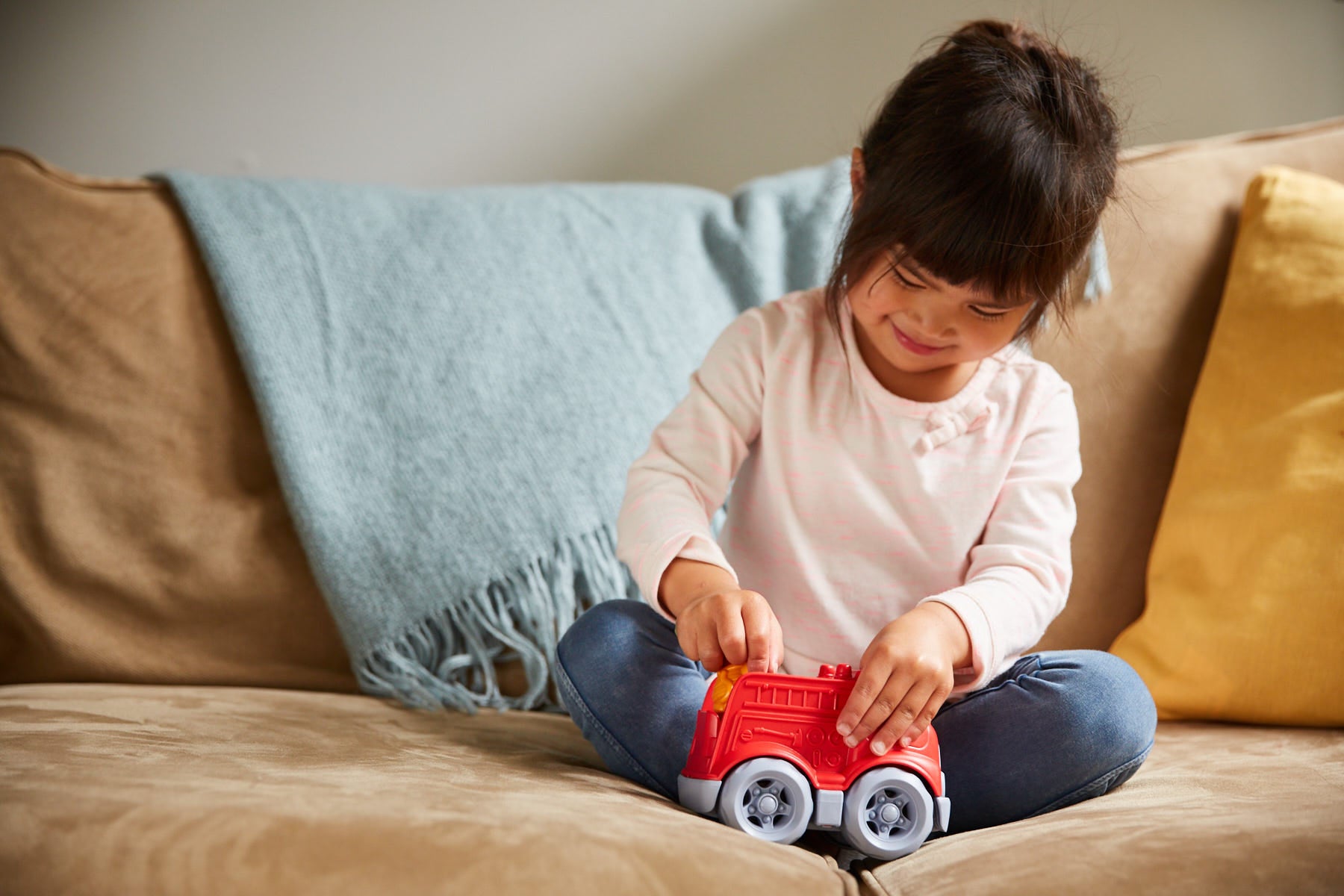 Girl playing with Fire Engine