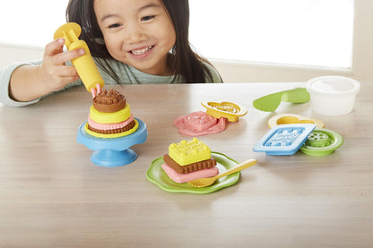 Girl playing with Cake Maker Dough Set