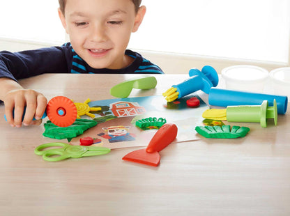 Boy playing with Tool Essentials Dough Set