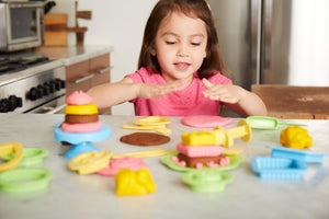 Girl playing with Cake Maker Dough Set