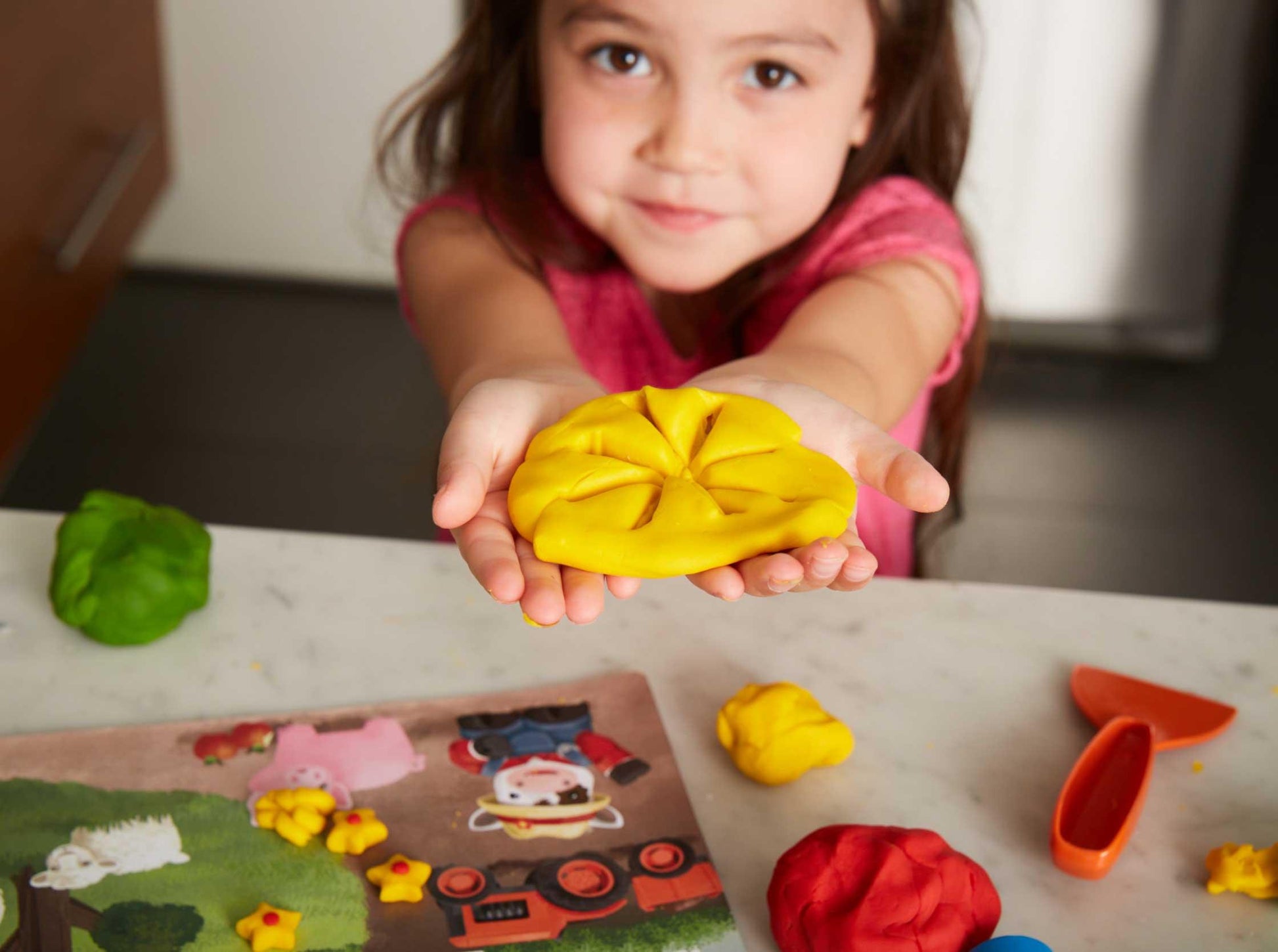 Girl playing with Tool Essentials Dough Set