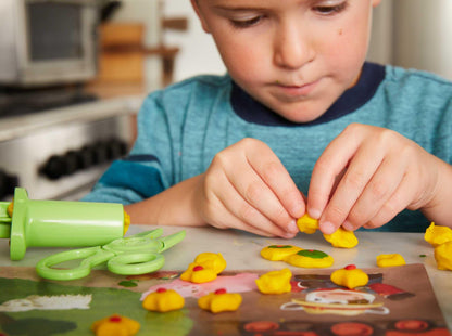 Boy playing with Tool Essentials Dough Set