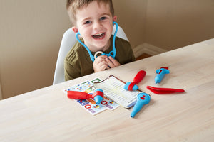 Boy playing with Doctor's Kit