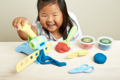 Girl playing with Extruder Dough Set