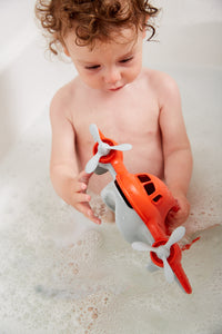 Child in bath playing with Fire Plane (Supports Fire Relief)