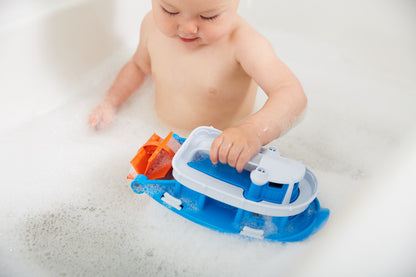 Child in bath playing with Paddle Boat