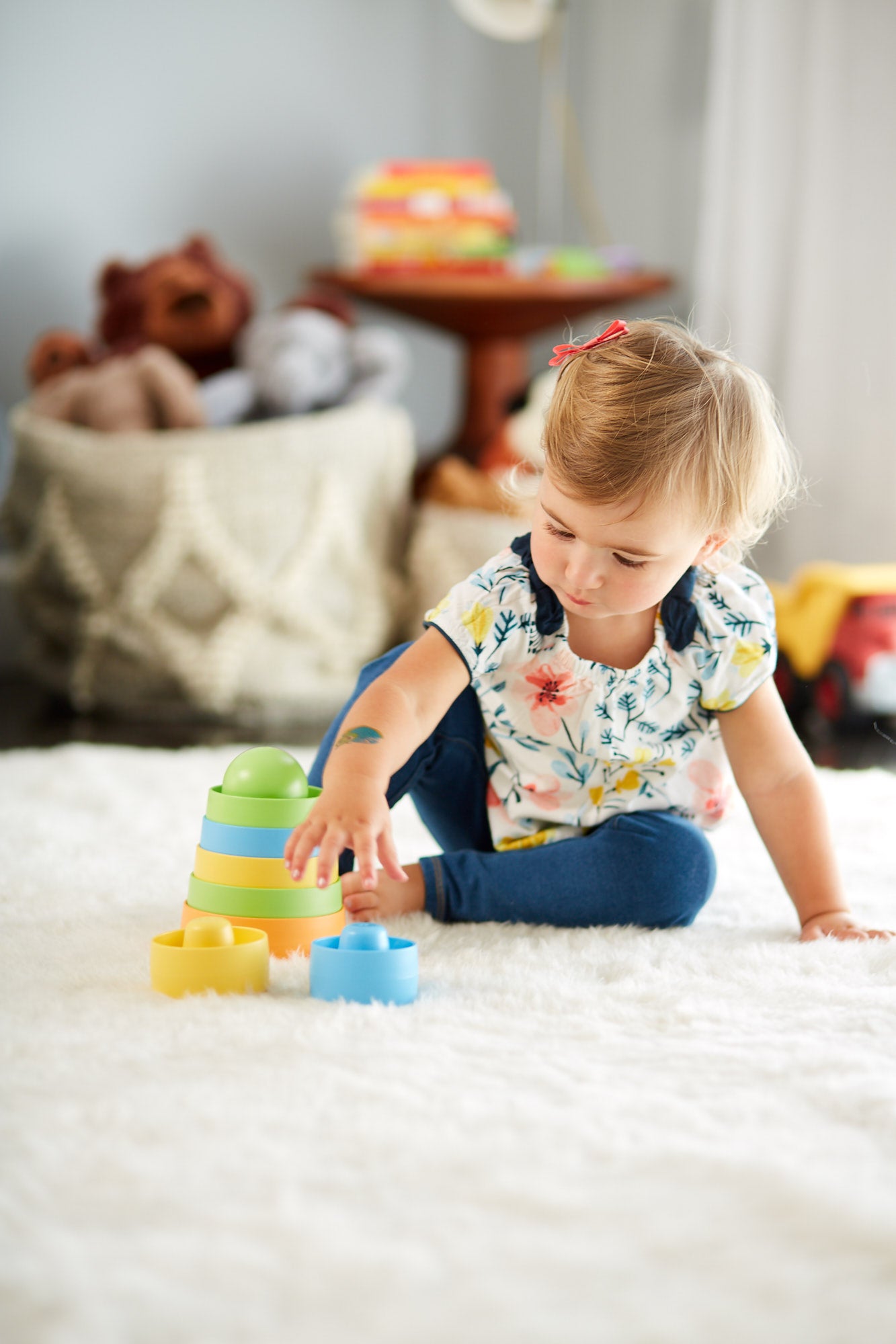Girl playing with the Stacker from the Boats and Building Set