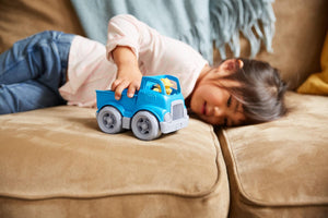Girl playing with Pick-Up Truck
