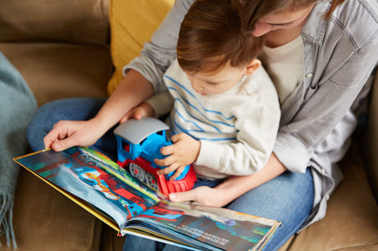 Parent reading Train off the Rails to child