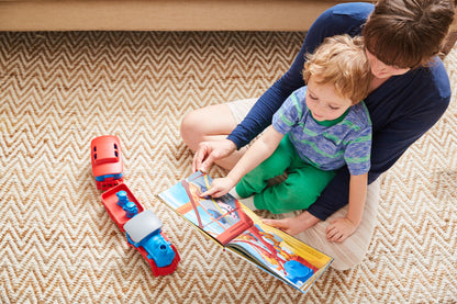 Parent reading Train off the Rails to child