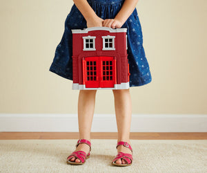 Girl holding Fire Station Playset