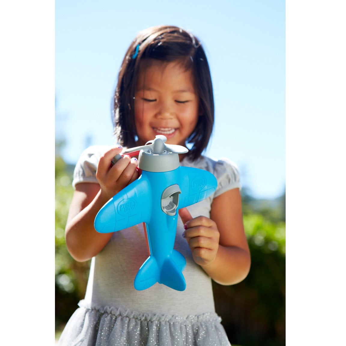 Girl playing with Airplane