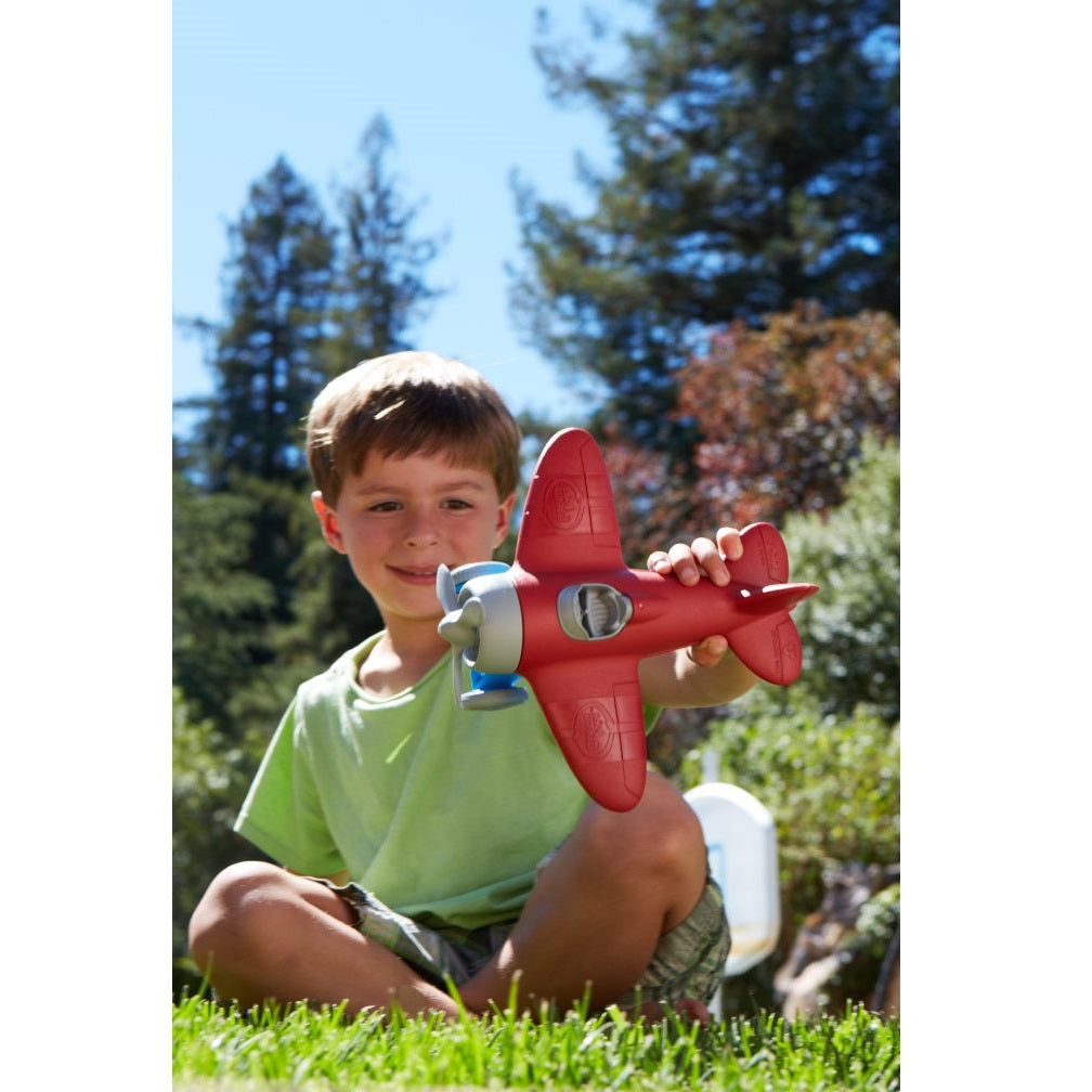 Boy playing with Airplane
