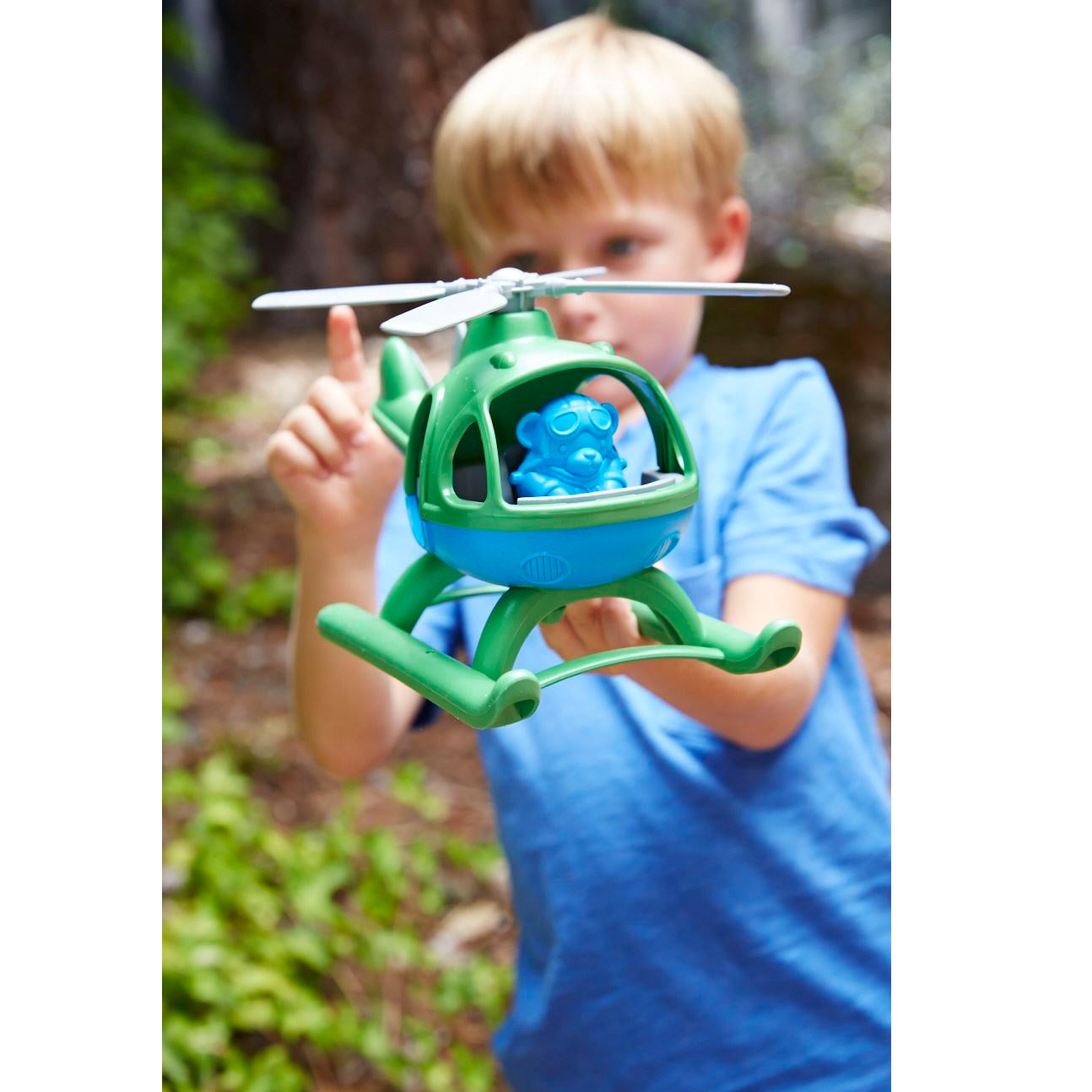 Boy playing with Green Top Helicopter