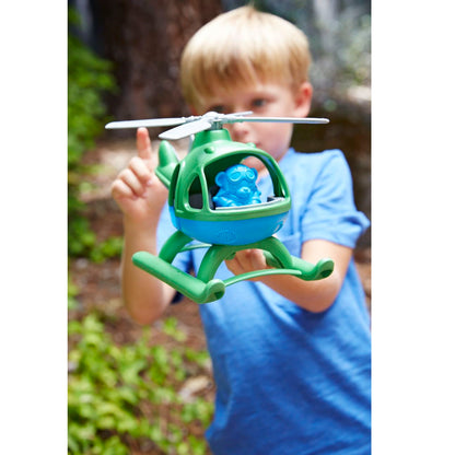 Boy playing with Green Top Helicopter