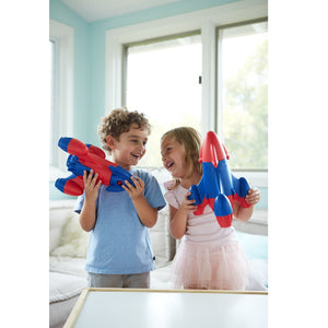 Boy and Girl playing with Blue and Red Top Rockets