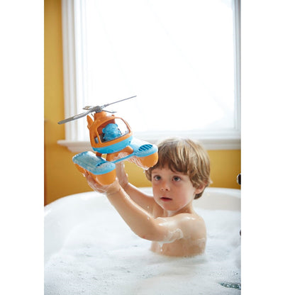 Boy in bath playing with Orange top Seacopter