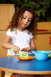 Girl playing with Chef Set