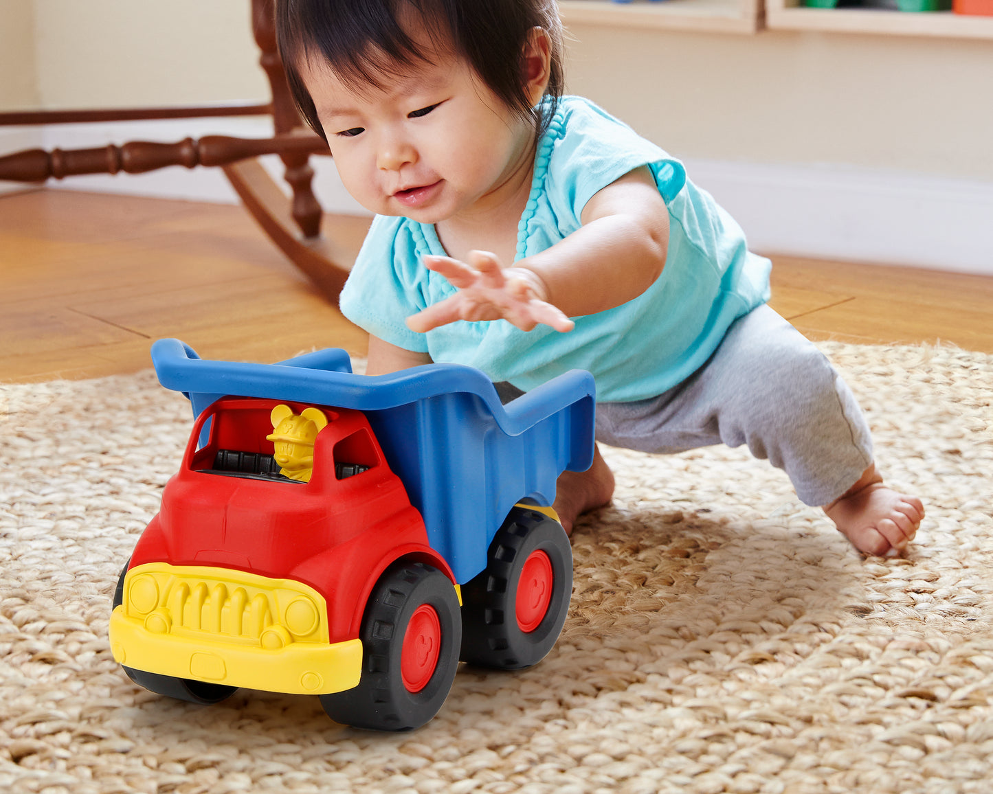 Girl playing with Mickey Mouse Dump Truck