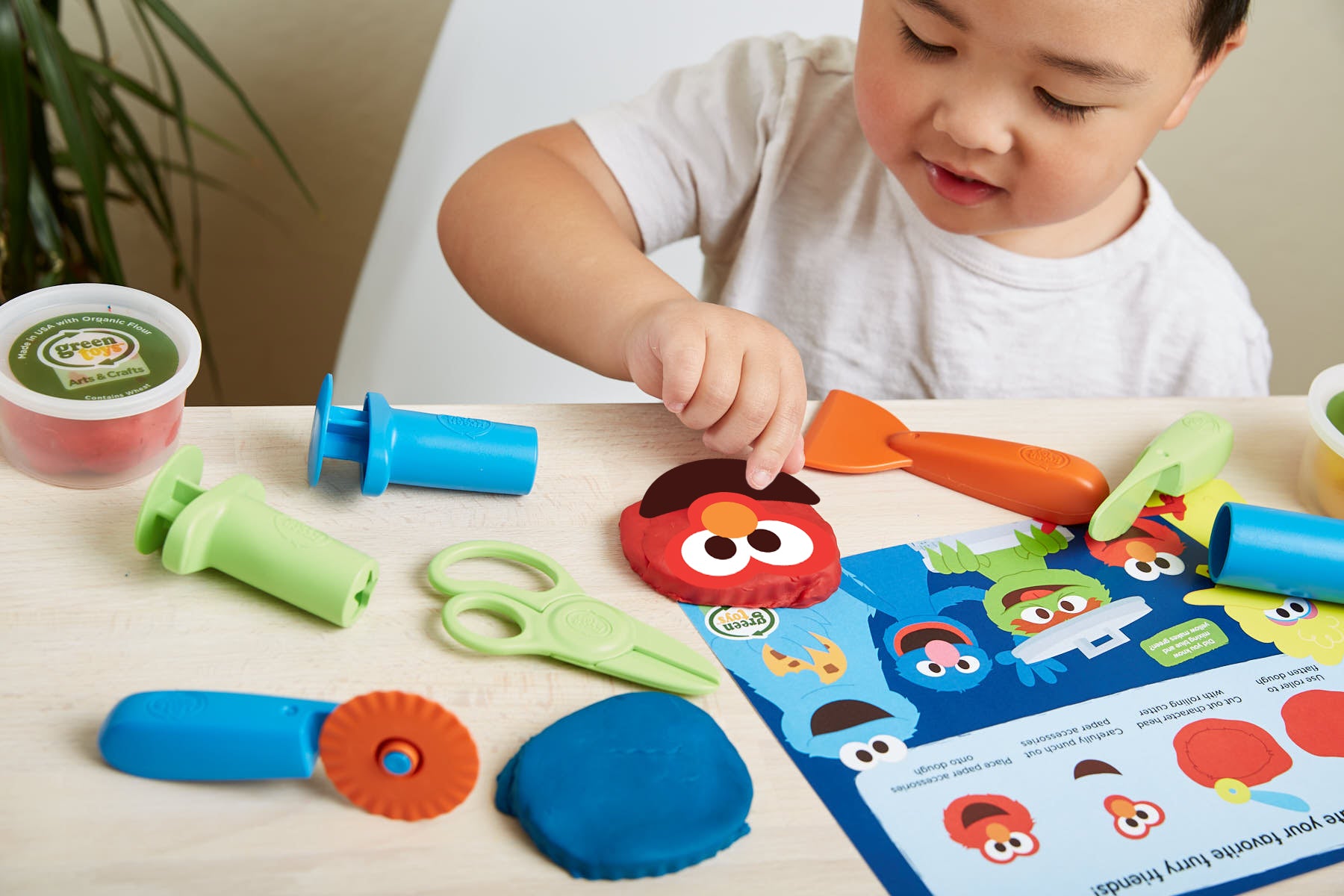 Boy playing with Elmo & Friends Dough Activity Set