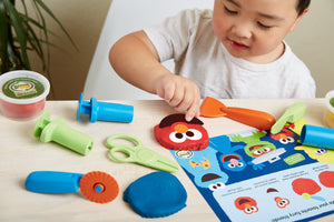 Boy playing with Elmo & Friends Dough Activity Set