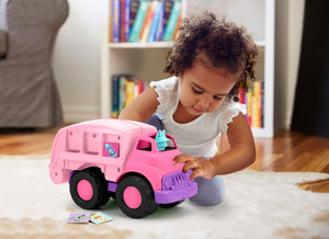 Girl playing with Minnie Mouse Recycling Truck