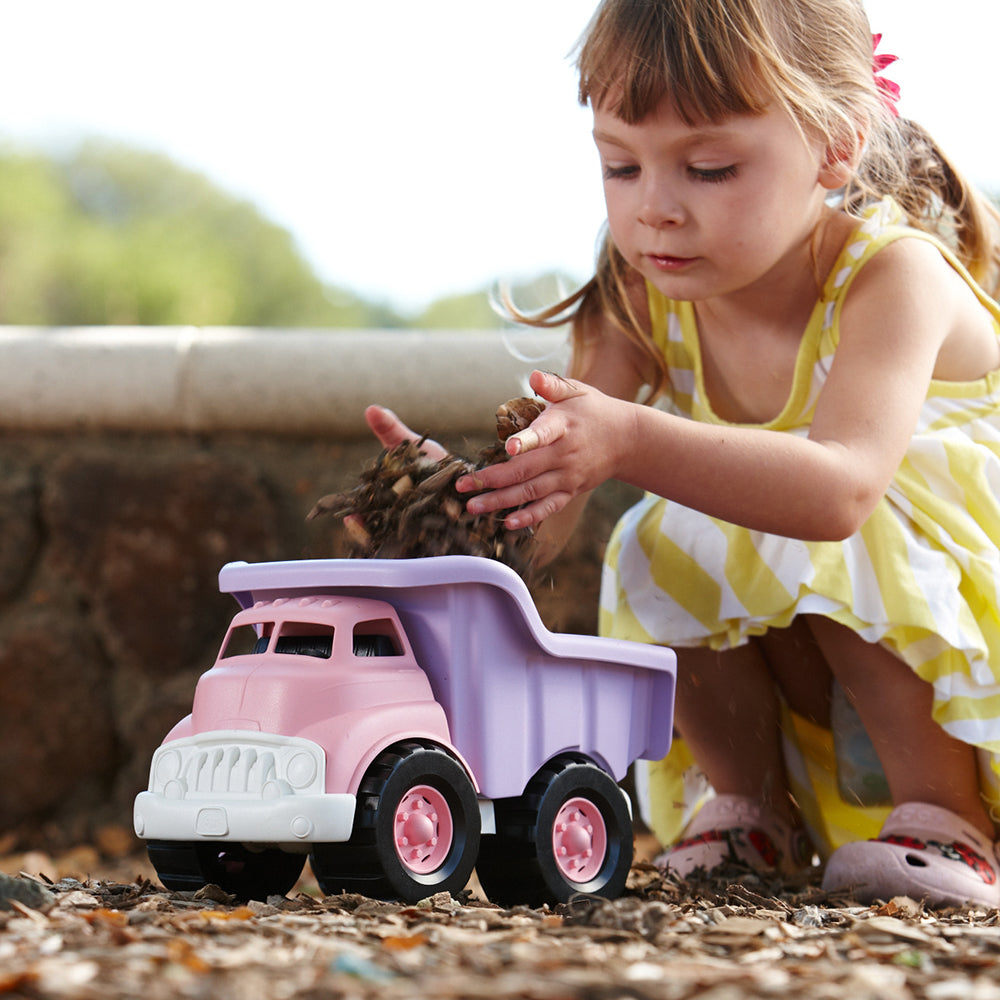 Girl playing with Pink Dump Truck