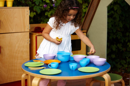 Girl playing with Cookware and Dining Set